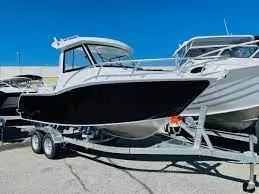 Plate aluminium hardtop cabin boat on a trailer at a dealership