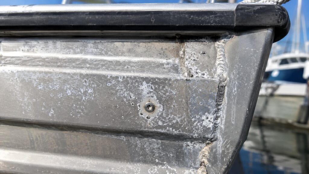 Aluminium boat corrosion showing pitting around a marine-grade aluminium weld