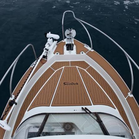 SeaDek EVA teak decking fitted across the bow of a plate aluminium boat