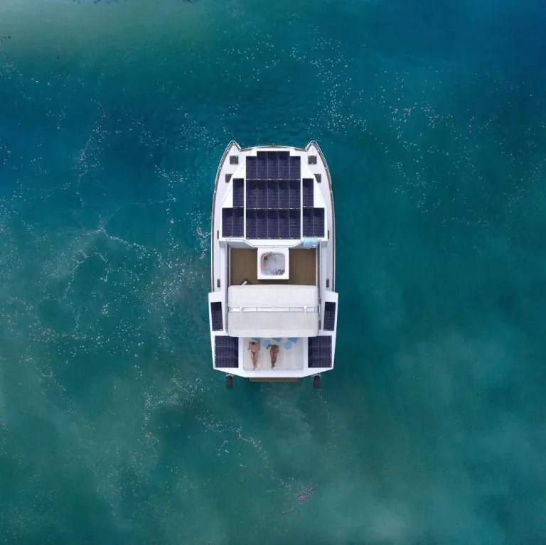 Aerial view of a plate aluminium boat over a reef
