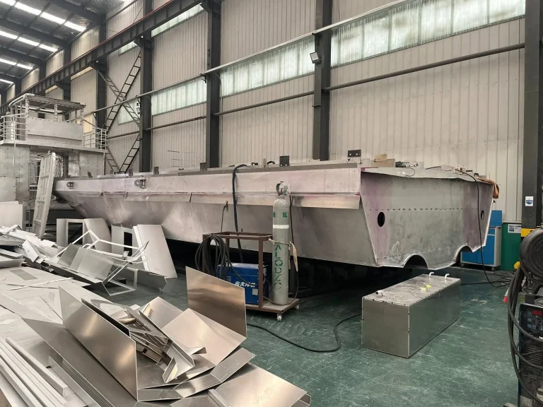 Aluminium hull and plate stock in the fabrication shop