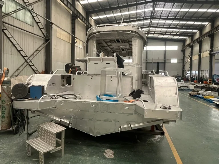 Aluminium hull with boarding steps under construction