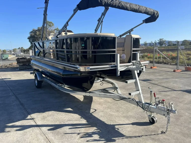 Aluminium pontoon boat on a trailer