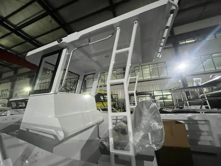 Bare aluminium boat with boarding ladder in the factory
