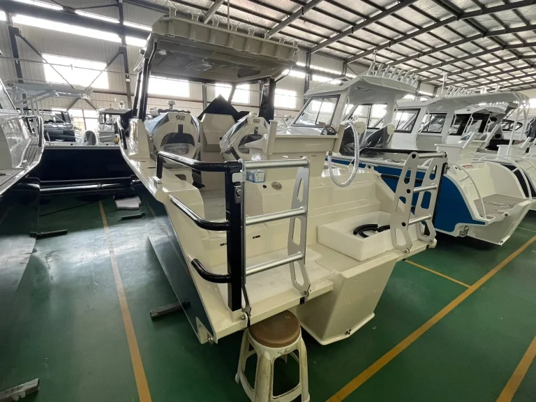 Bare aluminium boats on the factory floor