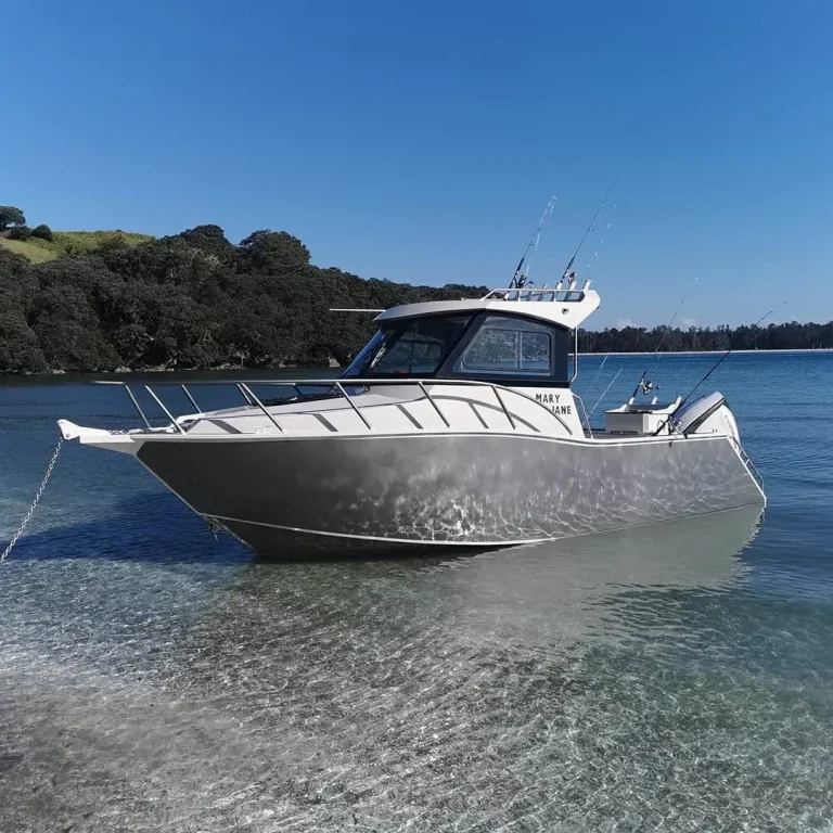 Bare aluminium cabin boat on calm water