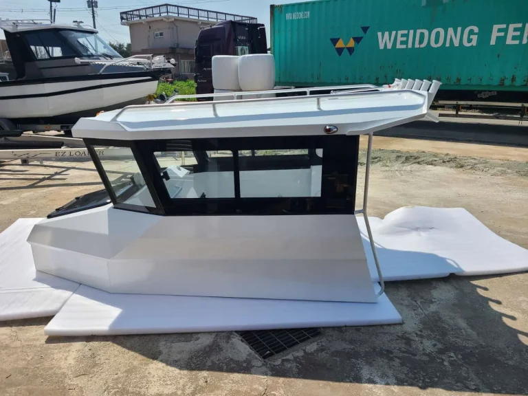 Bare aluminium cabin boat outside the factory