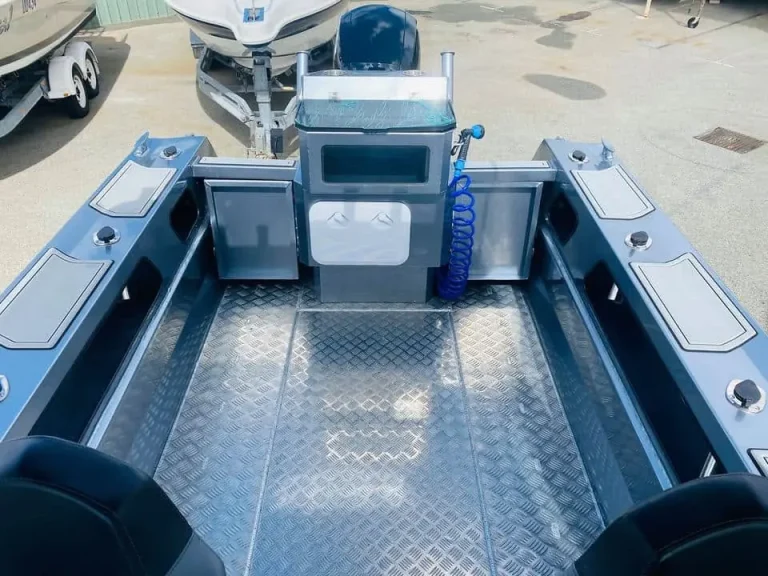 Bare aluminium cockpit with checker plate floor and seat box