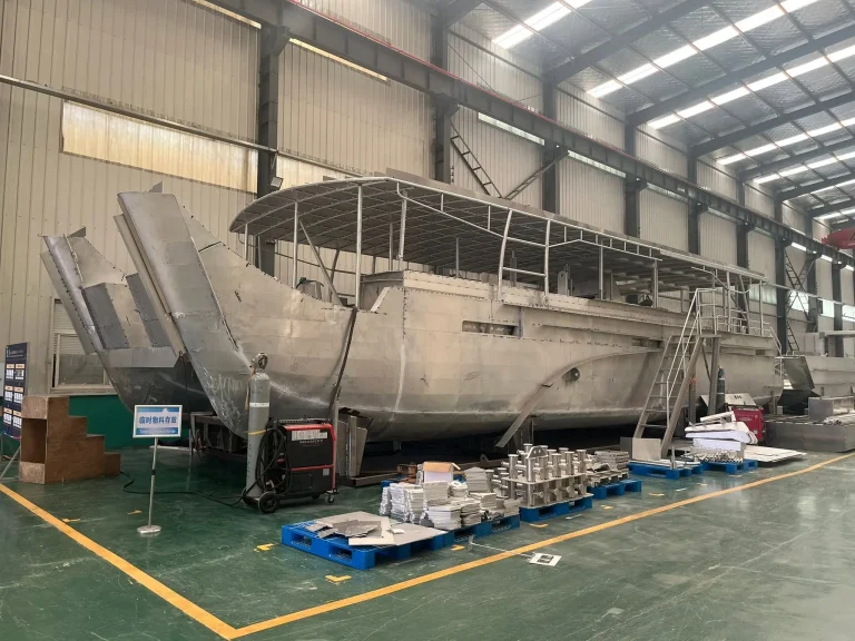 Bare aluminium cruiser hull in the fabrication shop