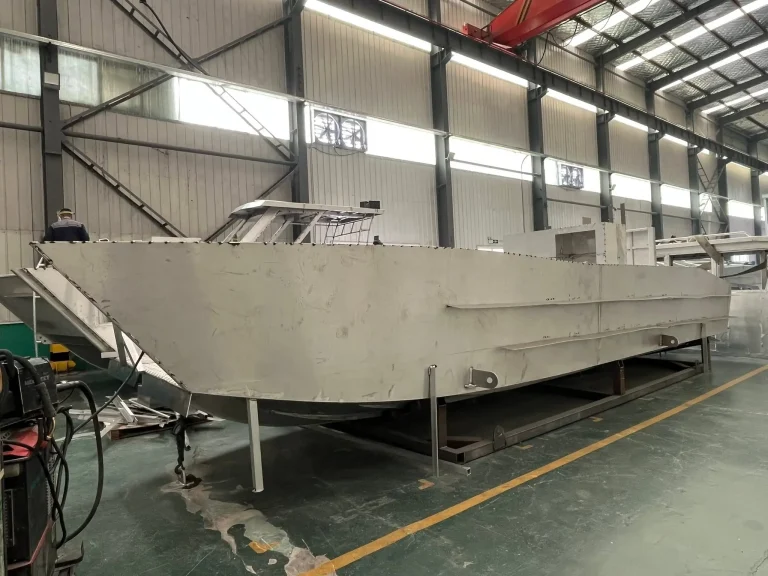 Bare aluminium hull on the factory floor