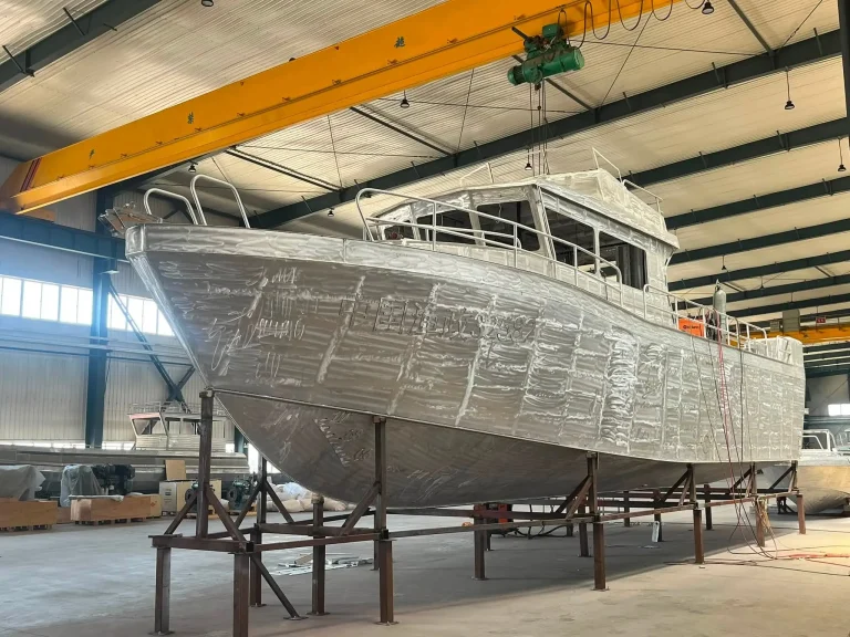 Bare aluminium hull with cabin on stands