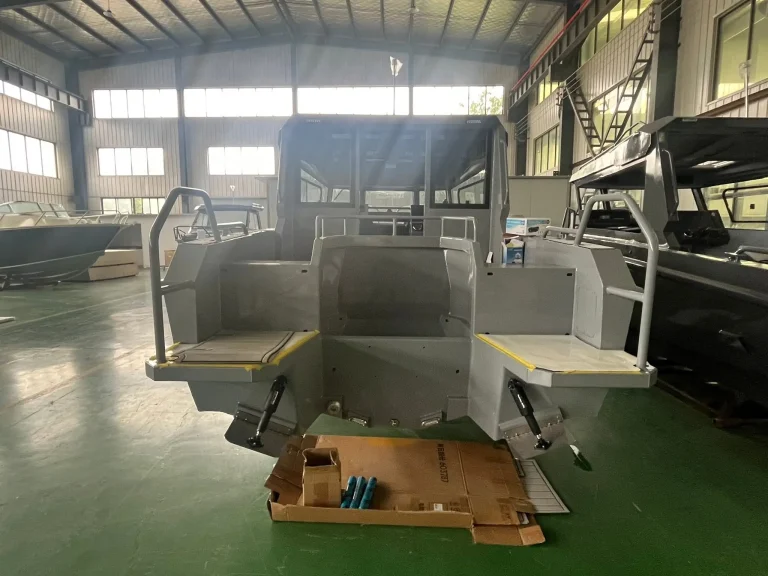 Bare aluminium hull with cabin on the factory floor