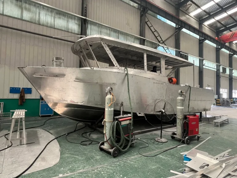 Bare aluminium hull with wheelhouse in build