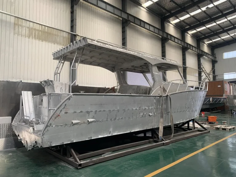 Bare aluminium landing craft with canopy in the factory