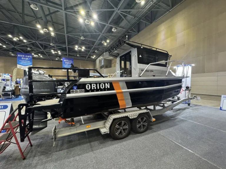 Black and orange plate aluminium boat on show display