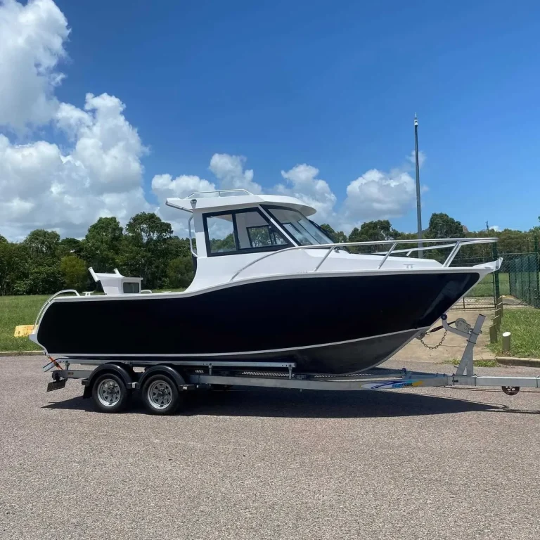 Black and white hardtop plate aluminium boat on a trailer