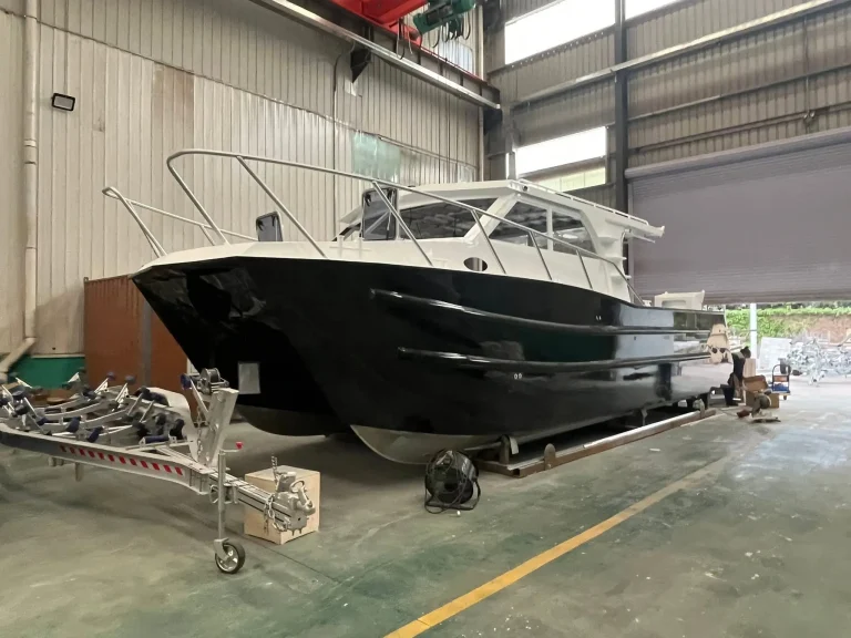 Black hulled plate aluminium boat under fit out