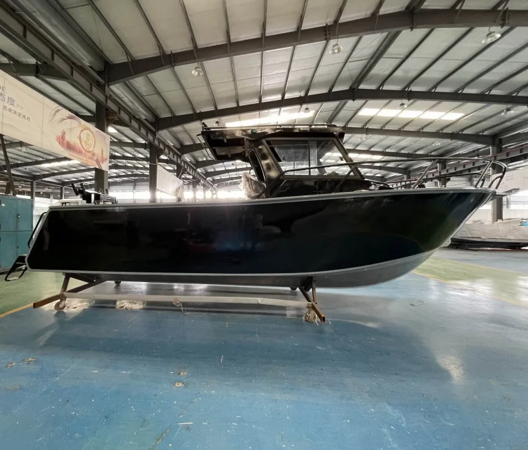 Black hulled plate aluminium boat under fit out