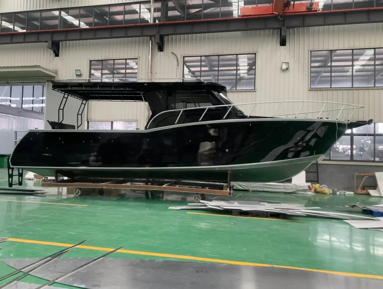 Black hulled plate aluminium cruiser on the factory floor