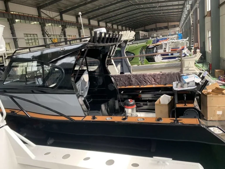 Black plate aluminium boat under fit out with timber decking