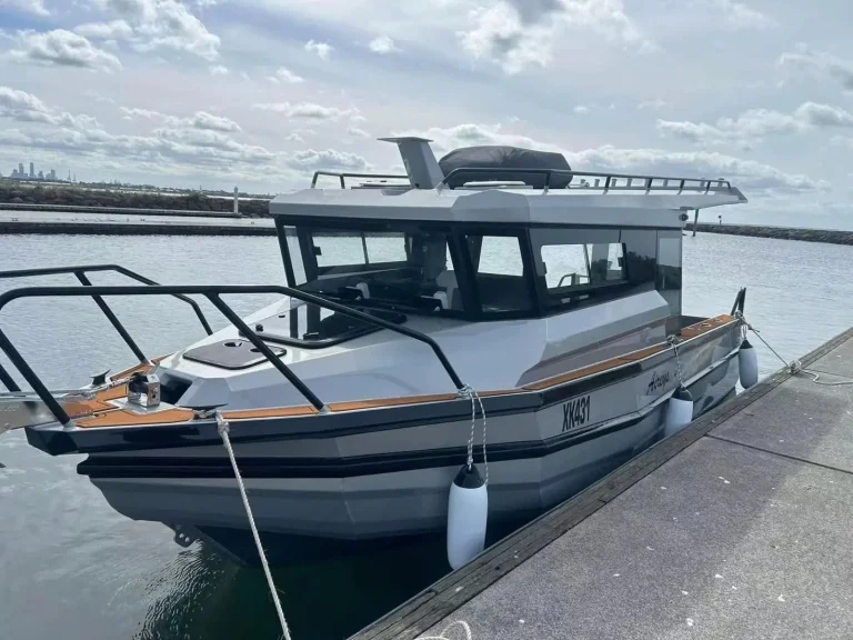 Black plate aluminium cruiser berthed at a pontoon