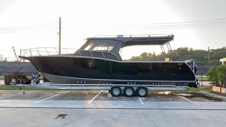 Black plate aluminium cruiser on a tri axle trailer