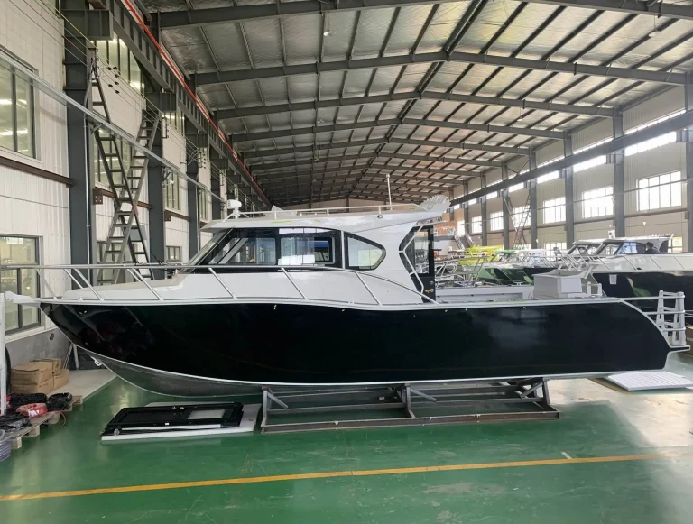 Black plate aluminium hardtop cruiser on the factory floor