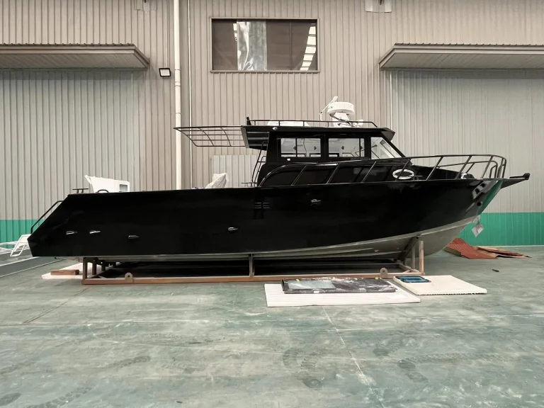 Black plate aluminium hull on stands in the factory