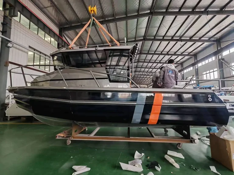Black plate aluminium hull with orange stripe in build