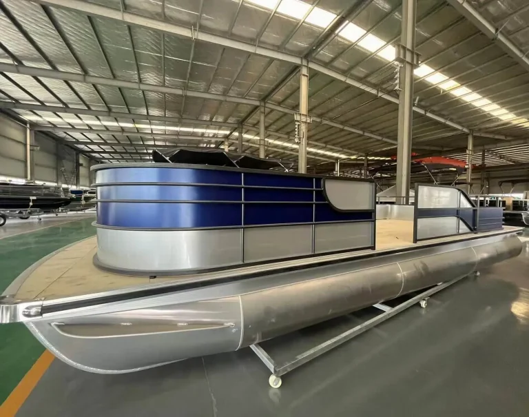 Blue aluminium pontoon boat on the factory floor