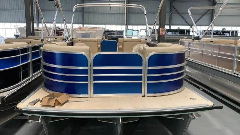 Blue and white aluminium pontoon boat with front lounge seating