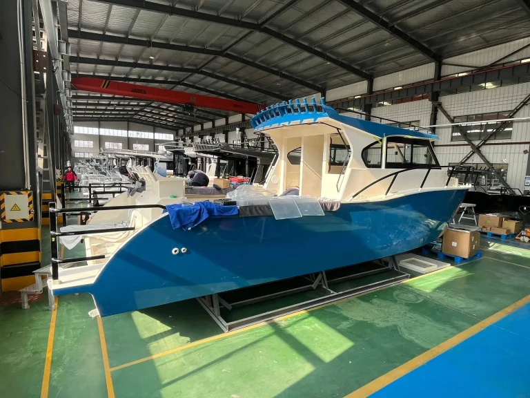Blue hulled plate aluminium boat in build
