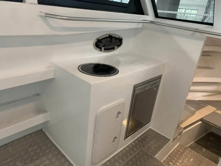 Bow deck detail with anchor well and rod holder