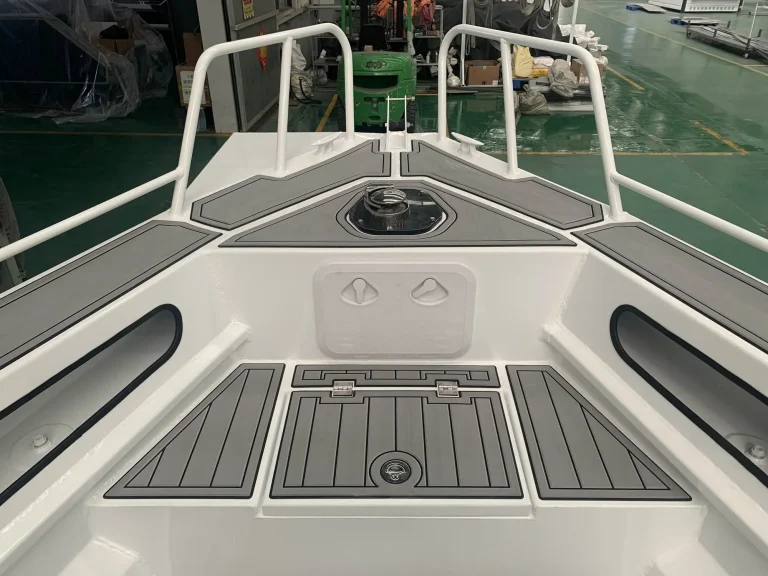 Bow deck with anchor locker and teak look floor