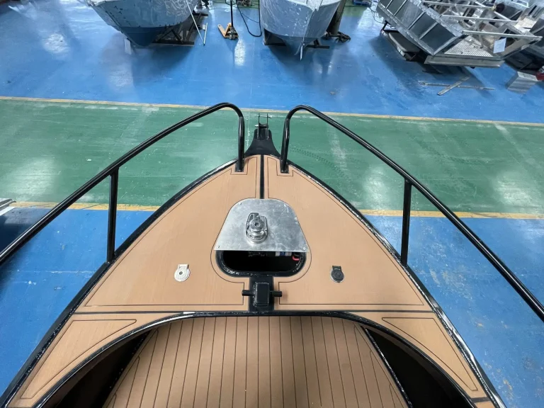 Bow deck with anchor winch and teak look floor