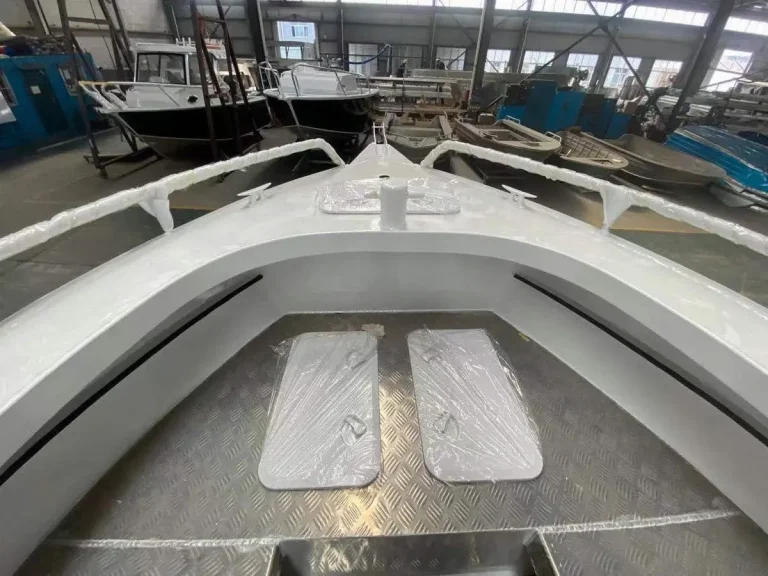 Bow deck with hatches under protective wrap