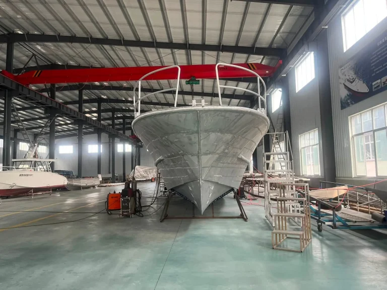Bow on view of a bare aluminium hull with rails
