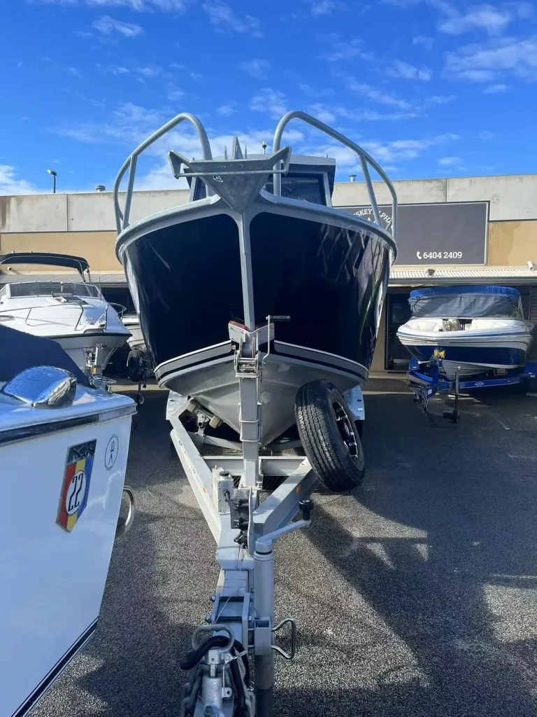 Bow on view of a hardtop plate aluminium boat on a trailer