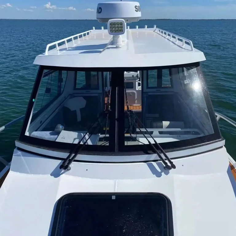 Bow on view of a white hardtop with radar arch