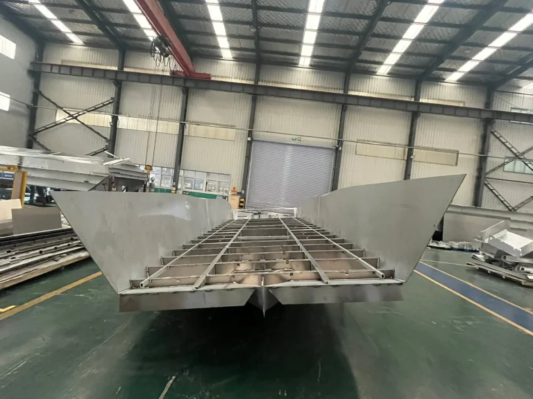 Bow on view of an aluminium catamaran under build