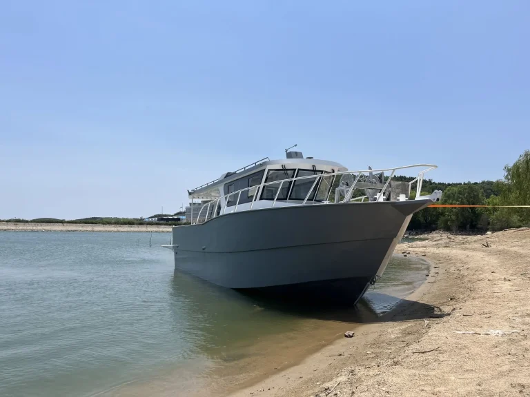 Bow ramp of a plate aluminium landing craft on the beach