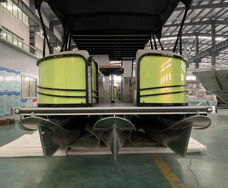Bow view of a pontoon boat with green trim