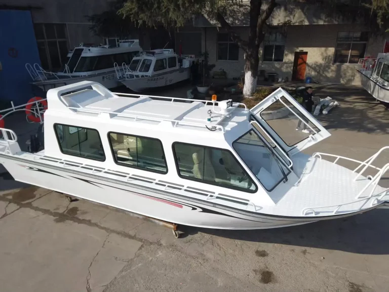 Bow view of a white passenger boat on the hardstand