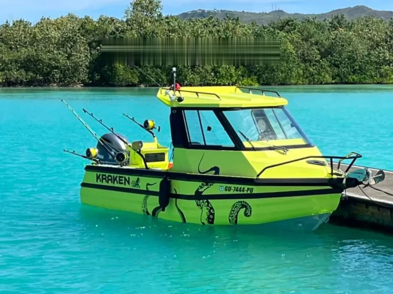 Bright green wrapped plate aluminium cabin boat on tropical water