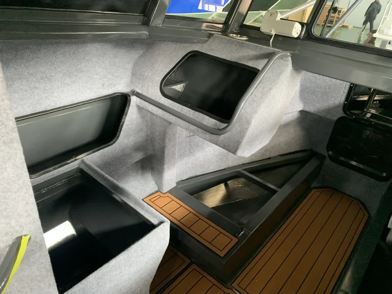 Cabin bunk with teak look floor and storage
