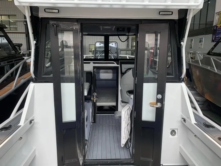 Cabin doors and wheelhouse entry with teak look floor