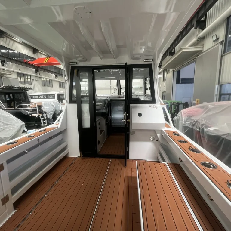 Cabin doorway and galley with timber look flooring