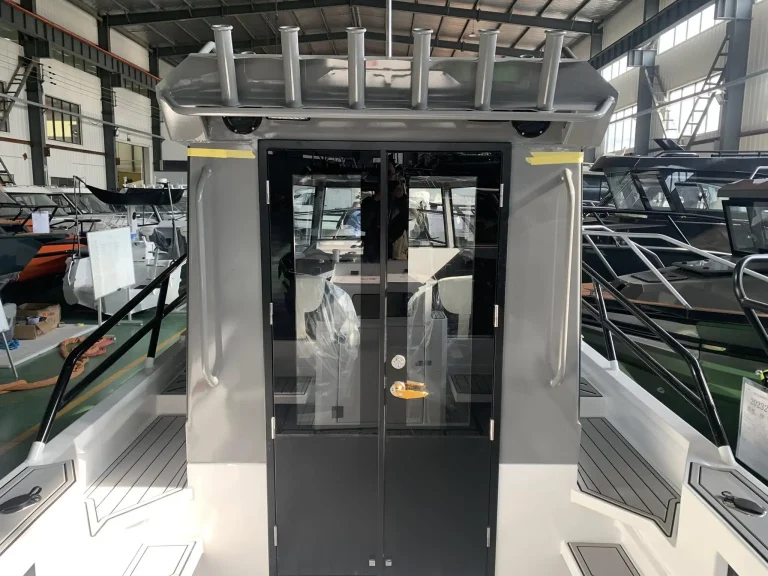 Cabin doorway and helm inside a plate aluminium boat