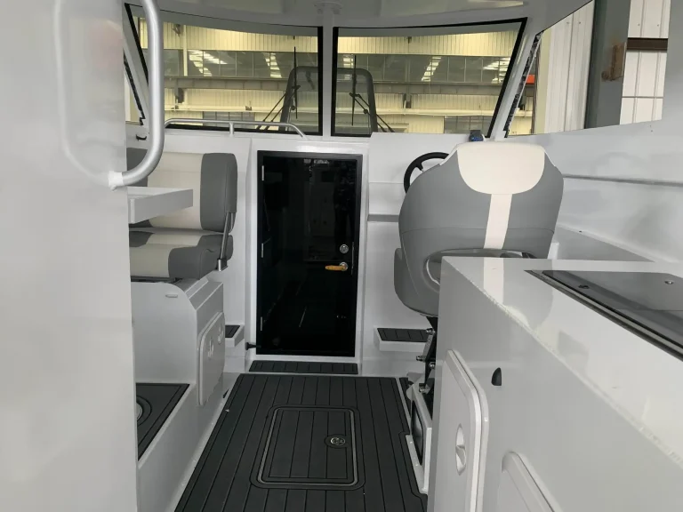 Cabin entry and galley with cream upholstery