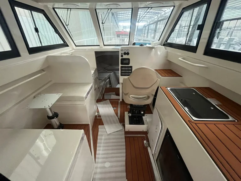 Cabin galley and helm with timber look joinery